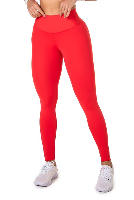 Legging básica vermelha em poliamida, projetado para conforto e mobilidade, ideal para treinos com estilo e praticidade.