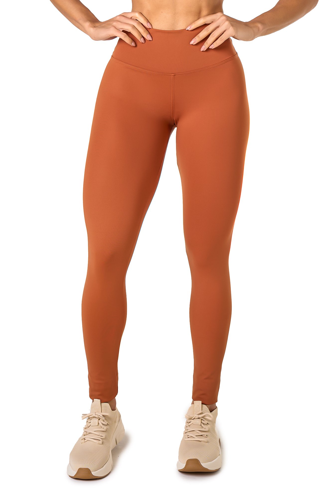 Legging básica marrom claro em poliamida, projetado para conforto e mobilidade, ideal para treinos com estilo e praticidade.